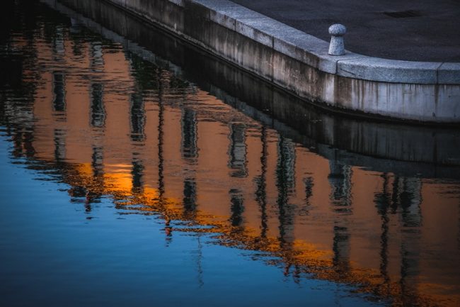 Amazing shot of an old city buildings reflection on the river