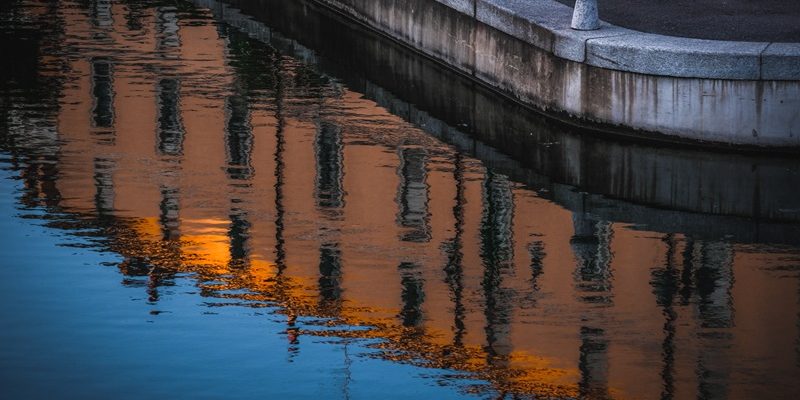 Amazing shot of an old city buildings reflection on the river