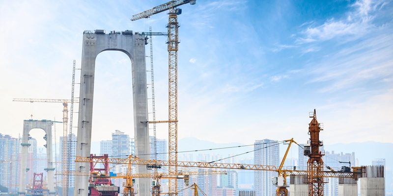 Construction of tall concrete pylon of bridge using tower crane